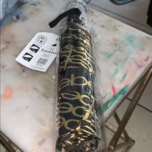 Bebe umbrella logo in gold printed all over sealed